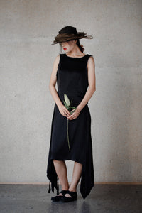 Woman wearing Ash Holden clothing black silk box dress linen lining 