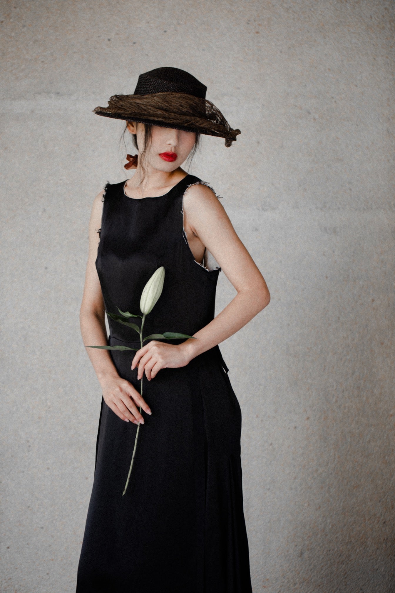 Woman wearing Ash Holden clothing black silk box dress linen lining 